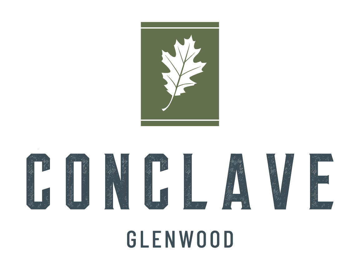A logo with a leaf and the words "CONCLAVE GLENWOOD" in front of it.